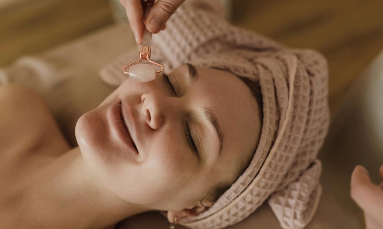 pexels-photo-6663456-6663456 A serene moment during a beauty treatment with a jade roller massage for facial rejuvenation.